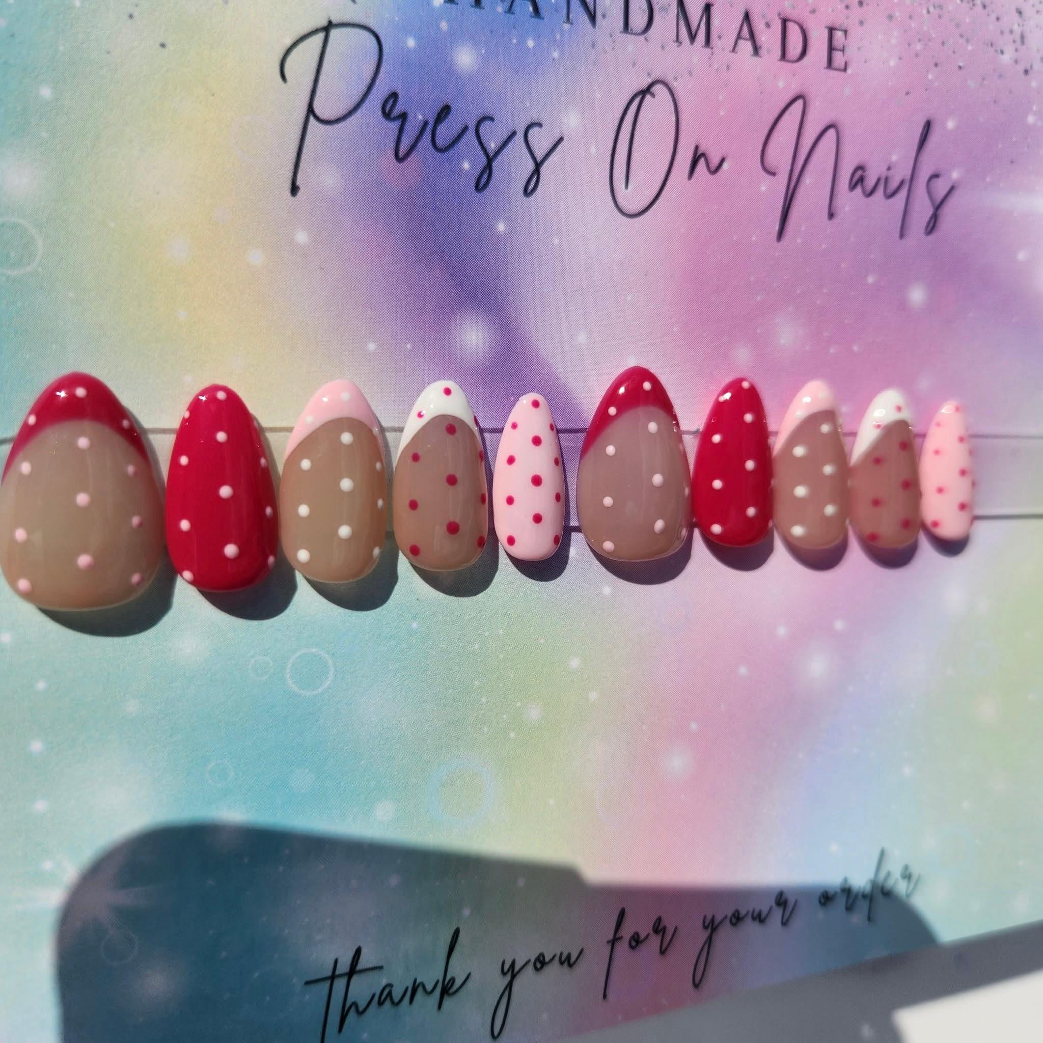 almond shape light dark pink polka dot French tip press ons