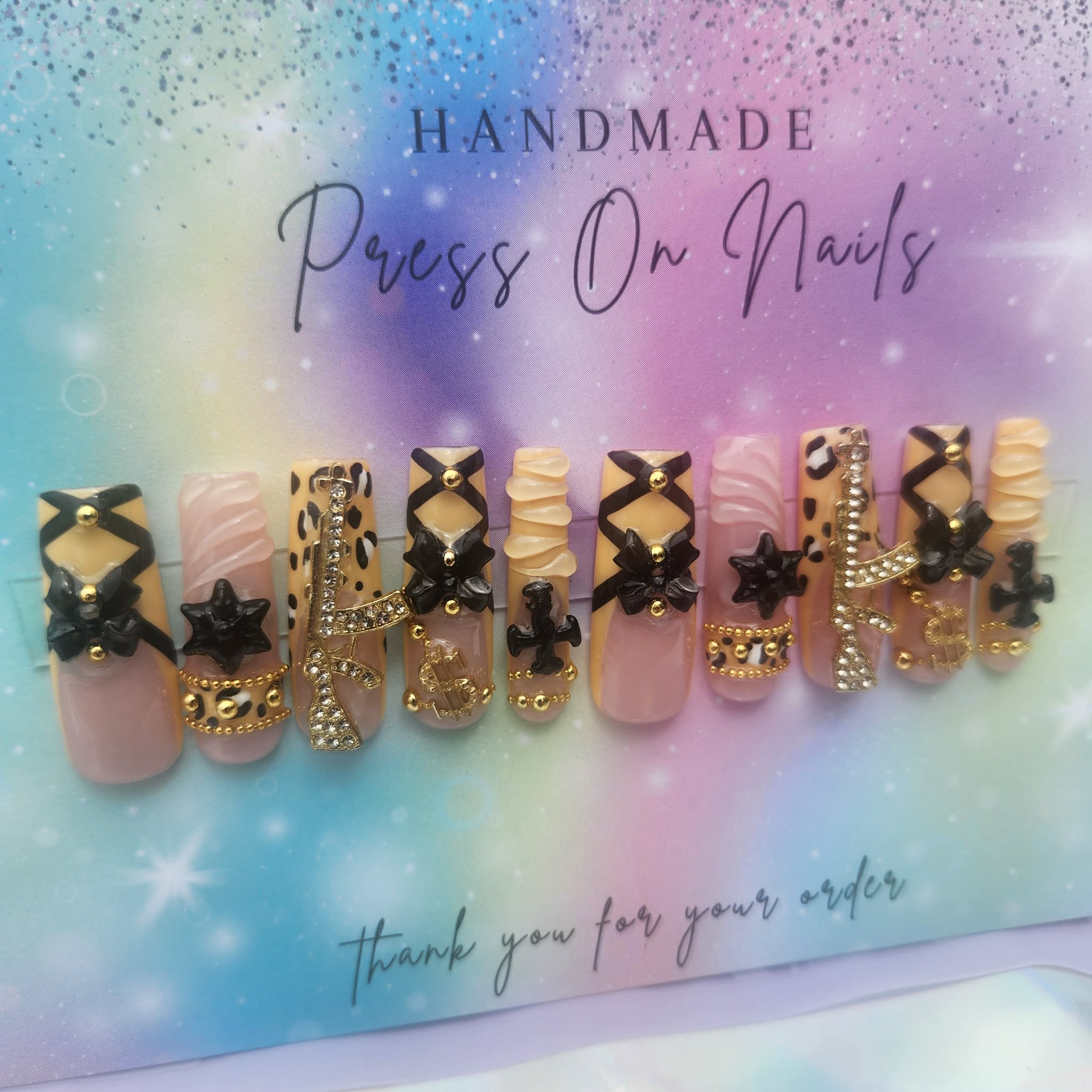 long, black, yellow, gold, beads, leopard money, star, cross bow, charms
