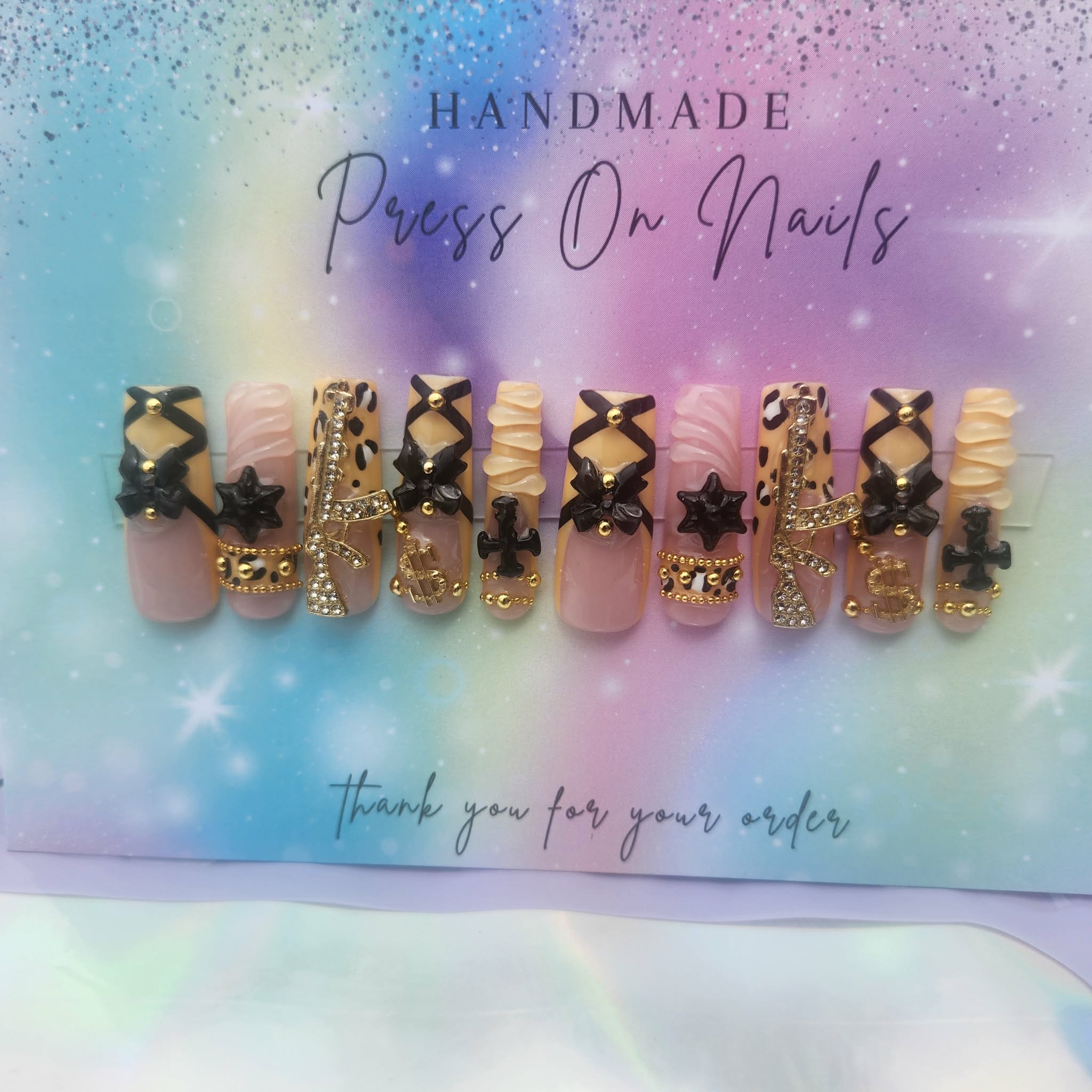 long, black, yellow, gold, beads, leopard money, star, cross bow, charms